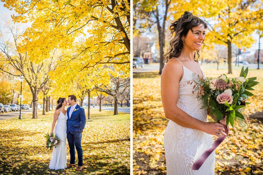Bride and groom embrace under a canopy of autumn leaves