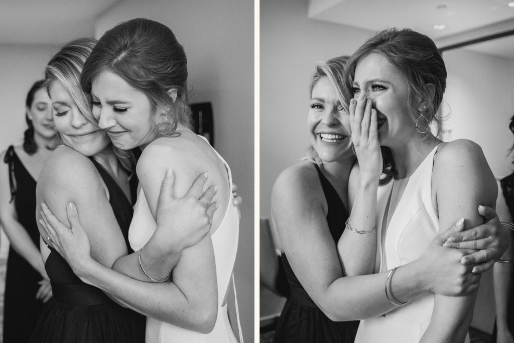Bride crying in the arms of her best friend