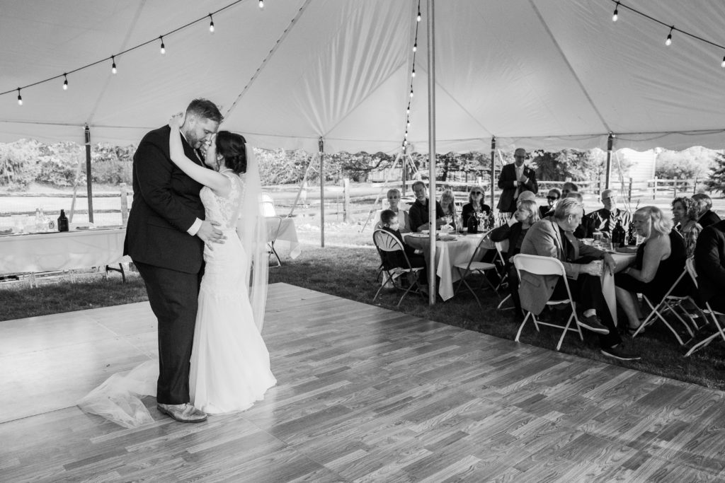 Bride and groom touch foreheads during their first dance