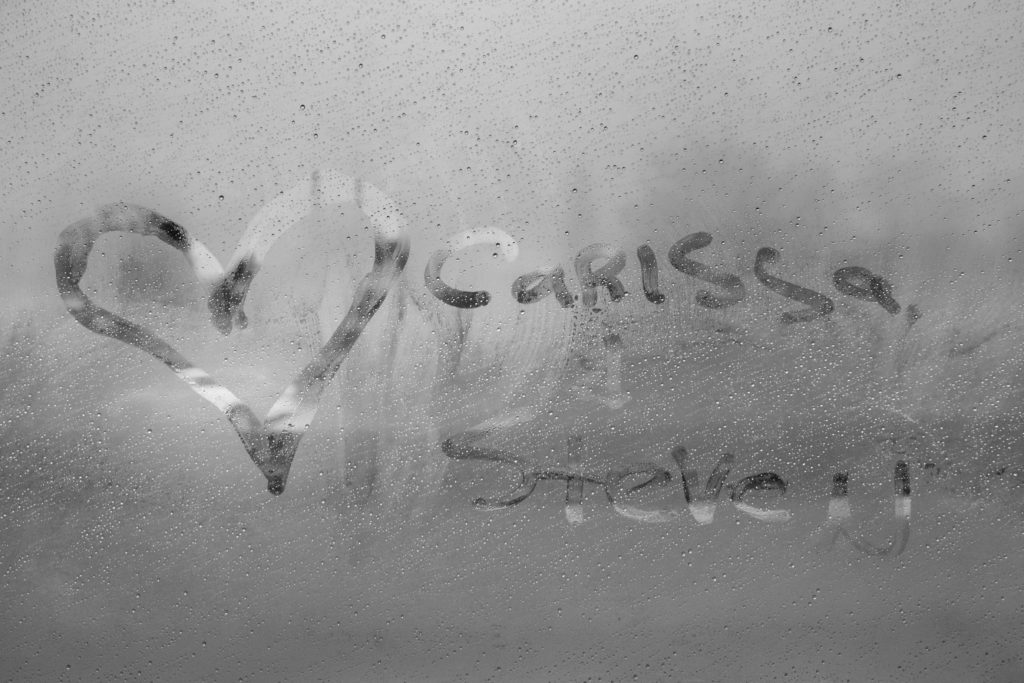 Carissa and Steven drawn on a foggy window