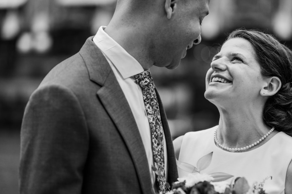 Bride and groom smile at each other after their Chicago City Hall Wedding Session