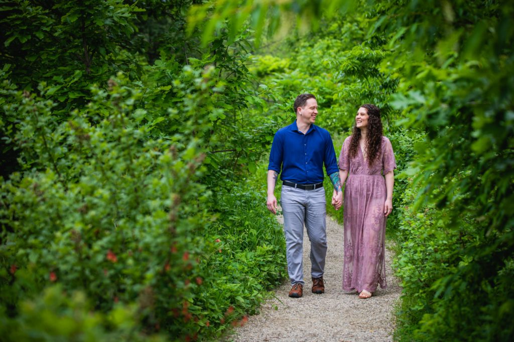Couple walking in the bushes