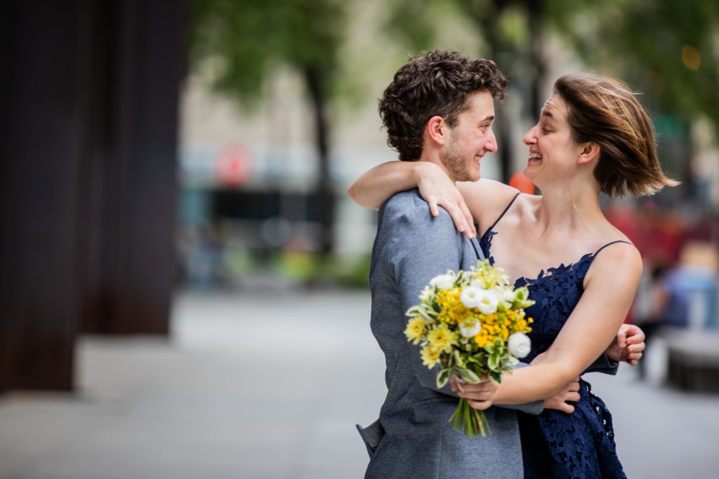 Bride and groom smile at each other in downtown Chicago