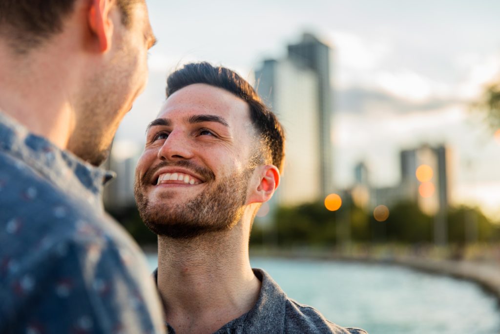 Man smiling at his boyfriend at North Avenue Beach