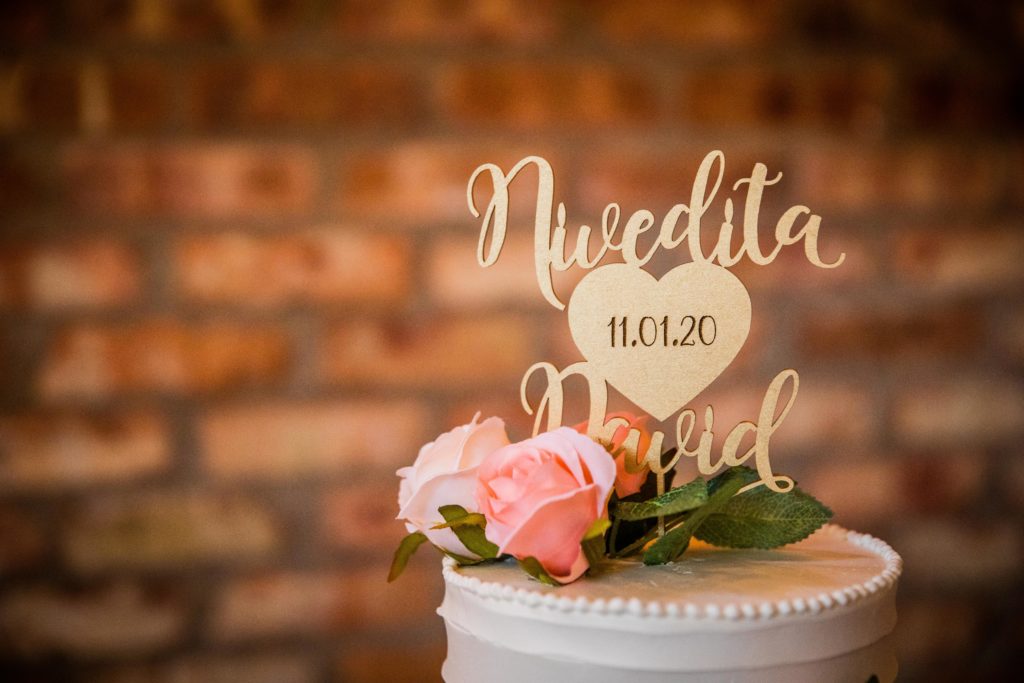 Cake topper with bride and groom's names in Stella Barra by Alliance Bakery