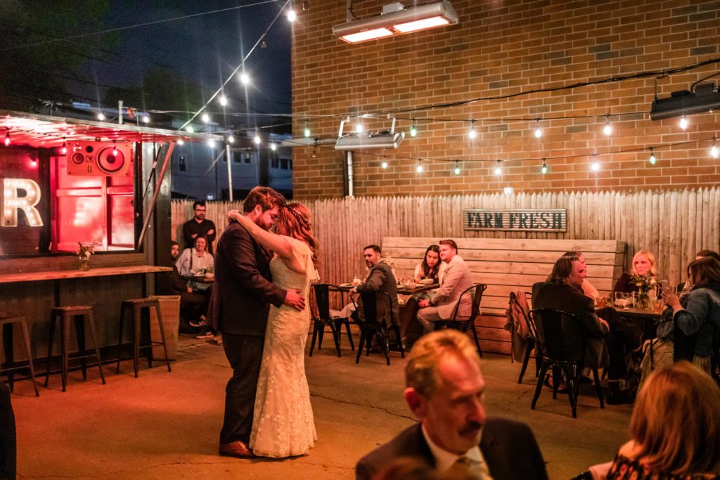 Couple have their first dance during their Reclaimed Bar and Restaurant Wedding reception