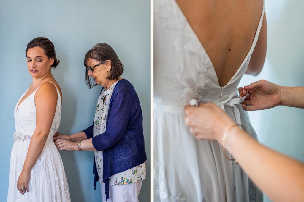 Mother of the bride helping her zip into her dress