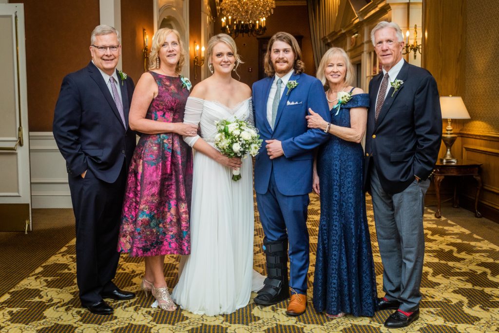 Couple poses for a formal family photo