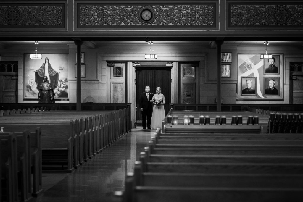 Bride and her dad wait to walk down the aisle at St. Hyacinth Basilica