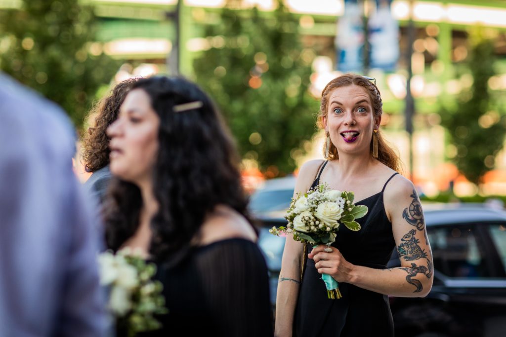 Bridesmaid sticking her tongue out