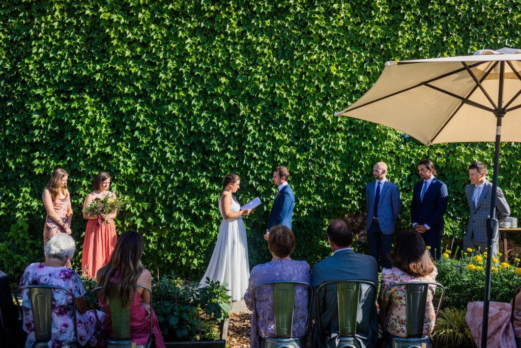 Bride reading her vows to the groom at Big Delicious Plant