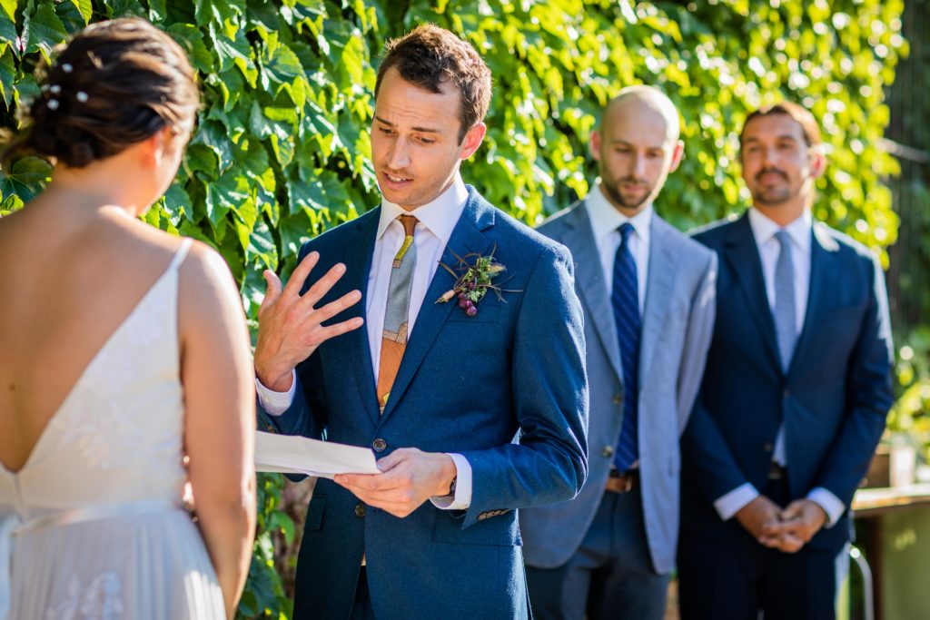 Groom reading his vows at Big Delicious Planet