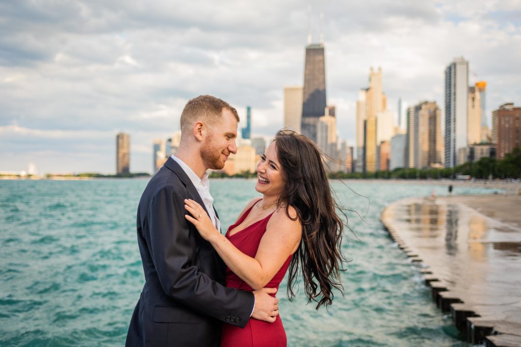Man and woman giggling in front of the Chicago city skyline
