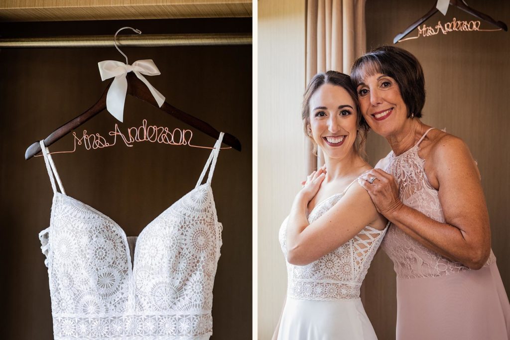 Bride posing with her mom in her wedding dress