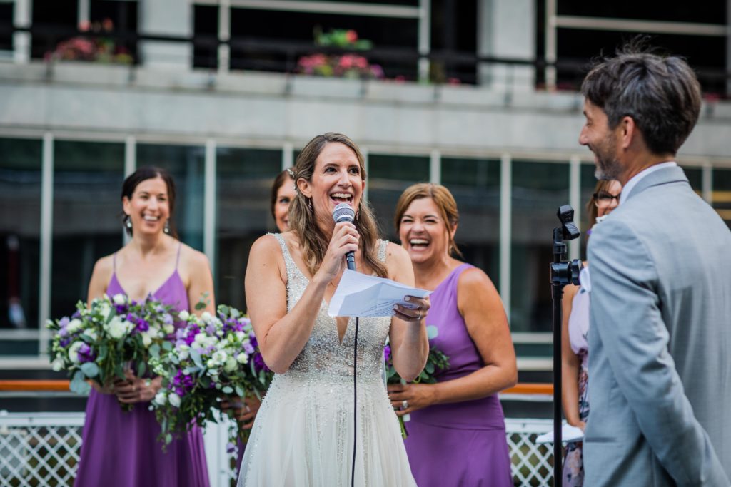 Bride laughing while giving her vows on Chicago's First Lady Cruise