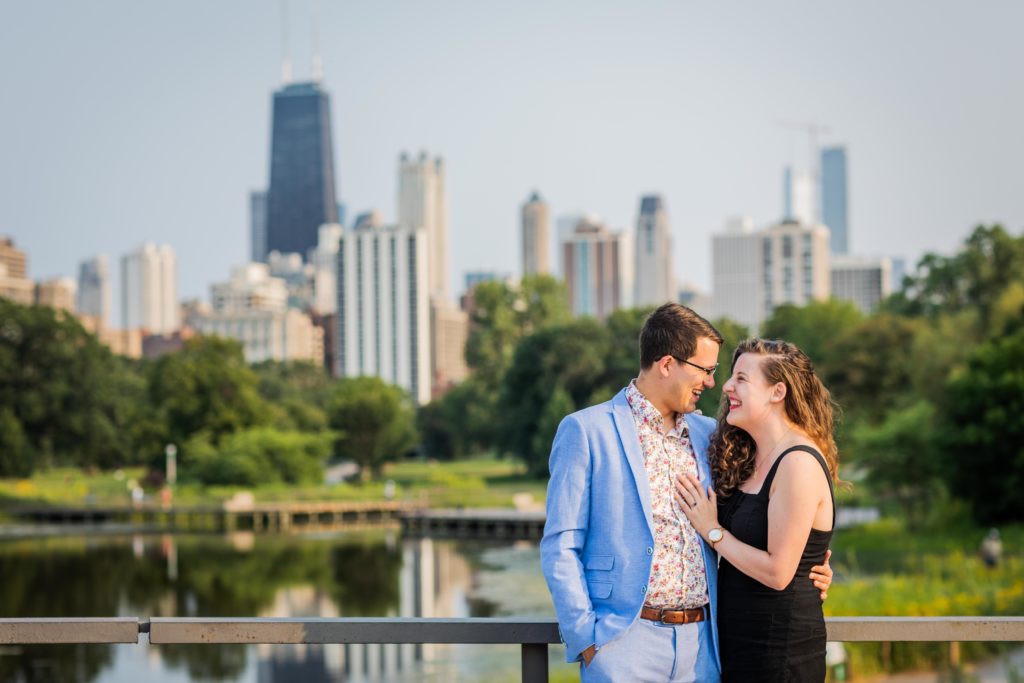 Couple smiling and looking at each other during their south pond engagement session