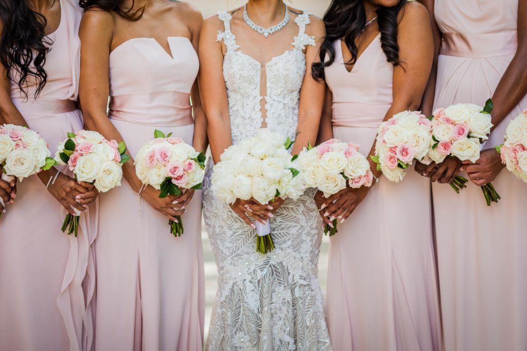 Brides holding their bouquets by Kehoe Designs