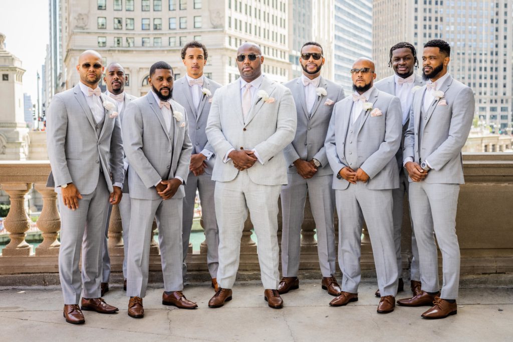 Groomsmen posing in downtown Chicago before the wedding at Venue SIX10