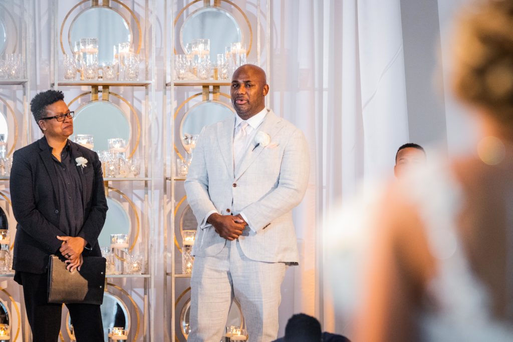 Groom crying as he sees his bride walk down the aisle