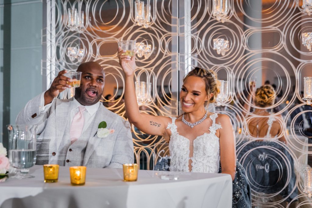 Couple holding up their glasses for a toast