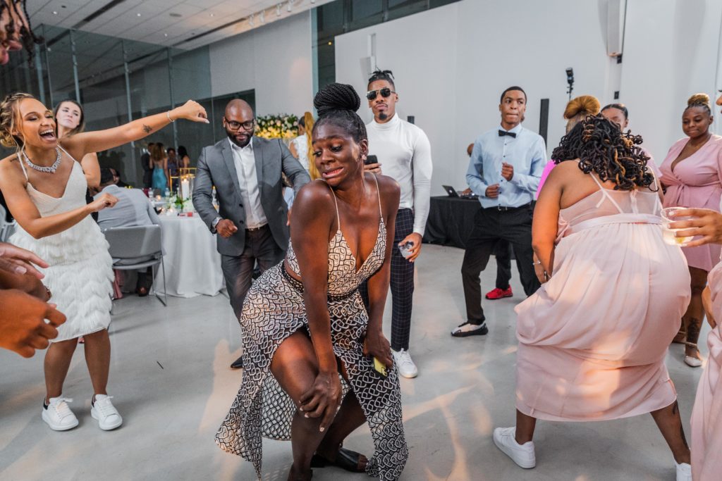 Wedding guest dances during the wedding at Venue SIX10
