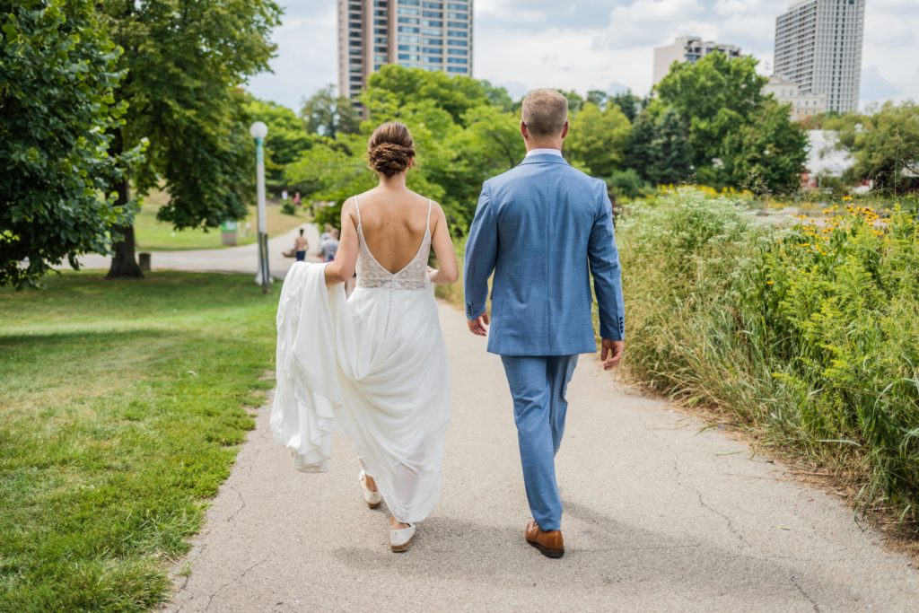 Bride and groom walking together in Lincoln Park