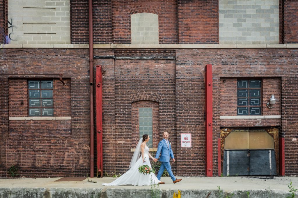 Couple walking together in the Fulton River District in Chicago before their wedding at Big Delicious Planet