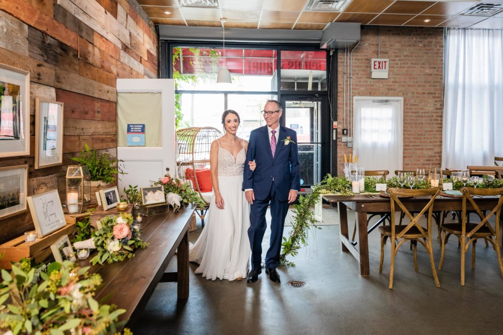 Bride and her father walking down the aisle at Big Delicious Planet