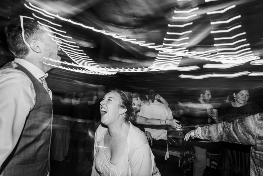 Bride smiling and laughing on the dance floor at her Dao House Wedding