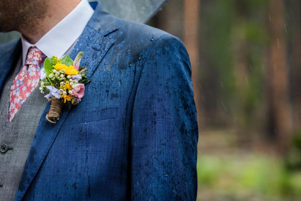 Rain hitting the groom's suit