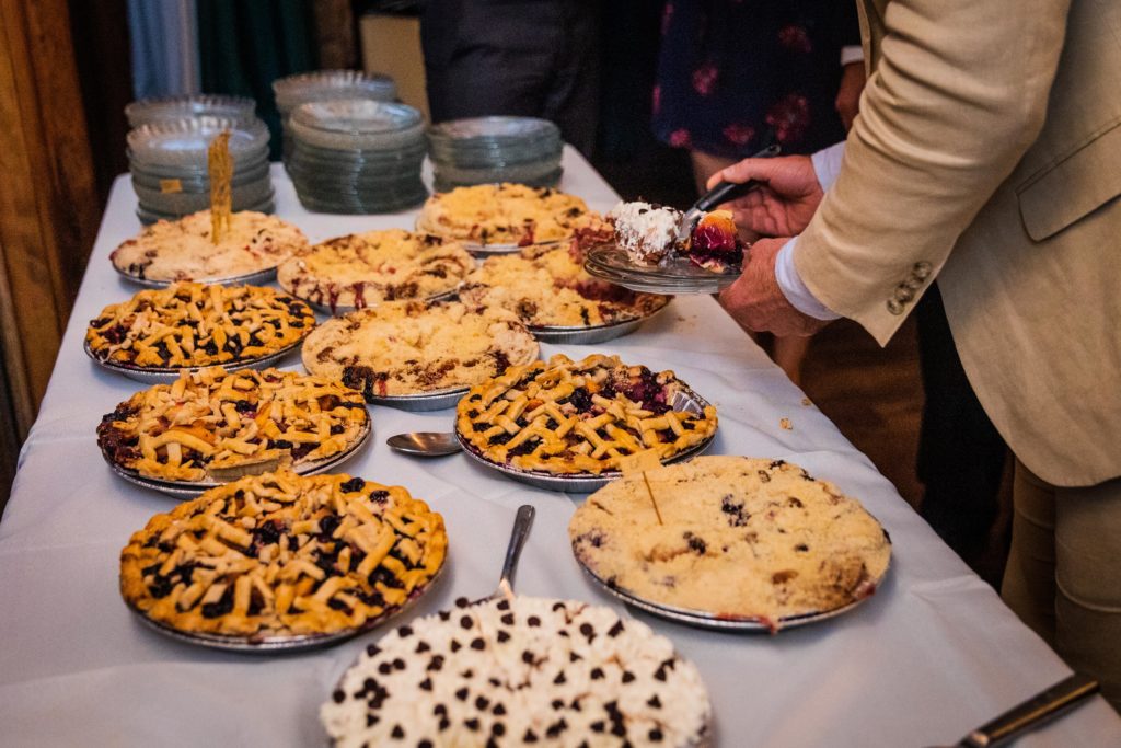 Pies spread out on a table for dessert