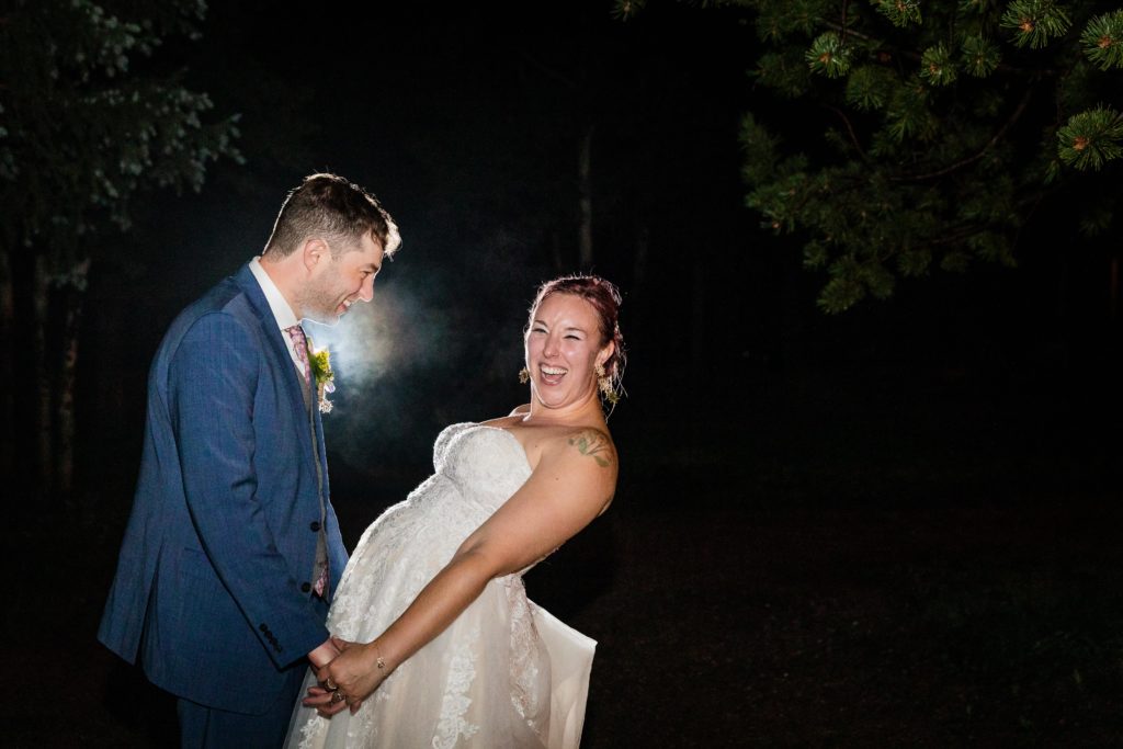 Bride laughs in the woods at their Dao House Wedding