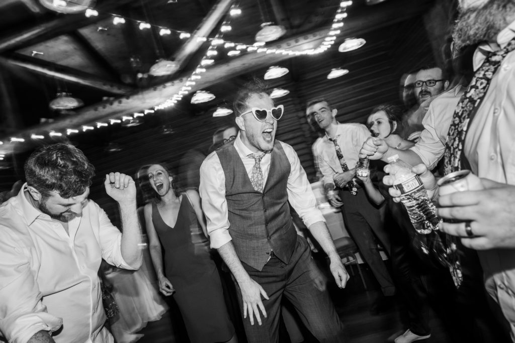 Groom screaming and jumping up and down on the dancefloor