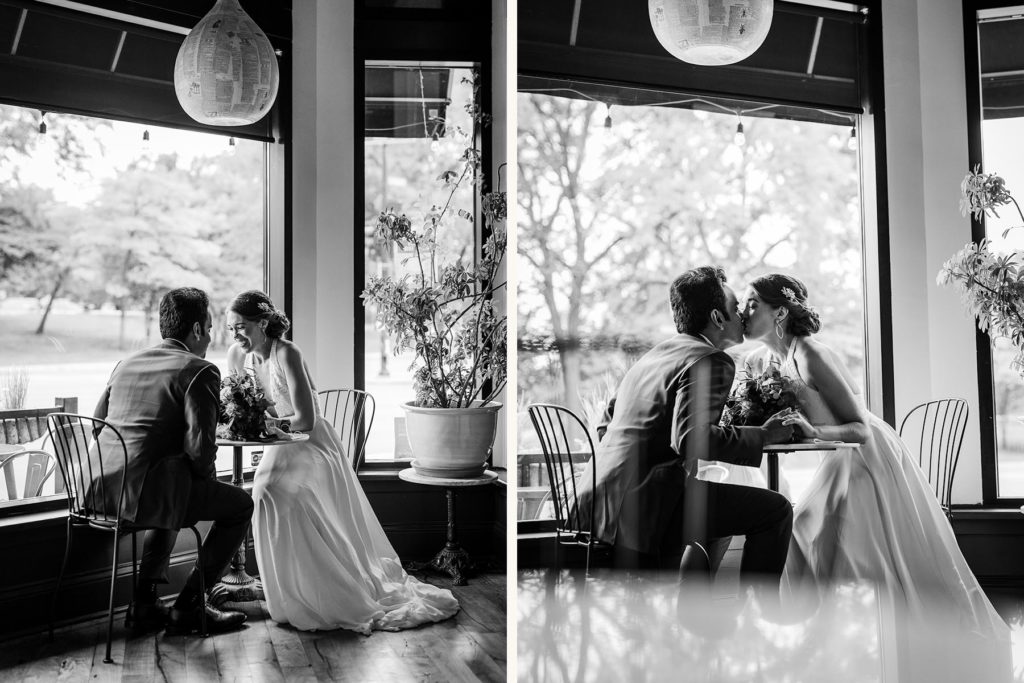 Bride and groom kissing in Webster's wine bar