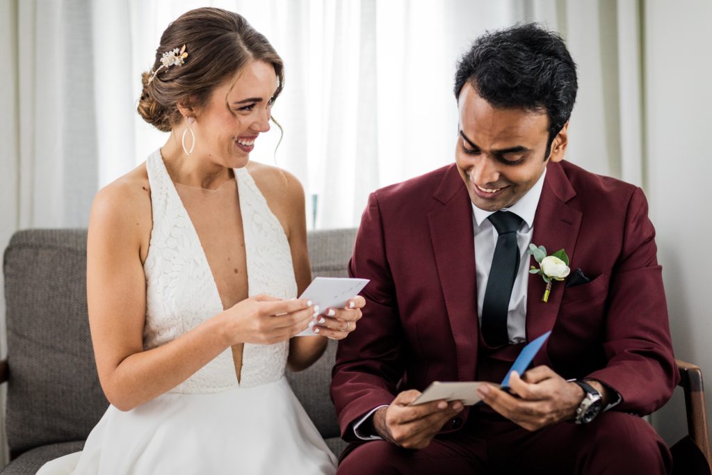 Bride and groom reading love notes to each other