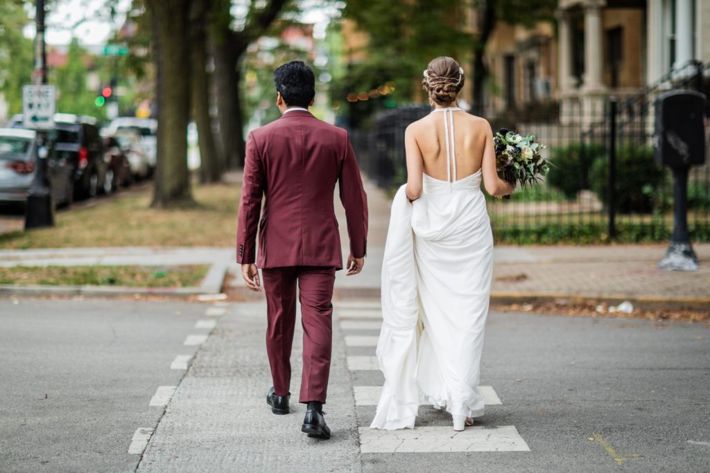 Bride and groom walking in Logan square