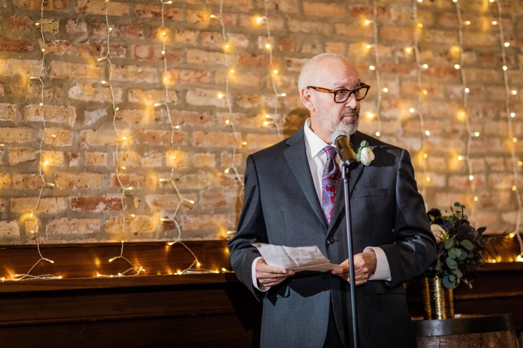 Father of the bride giving a speech at dinner