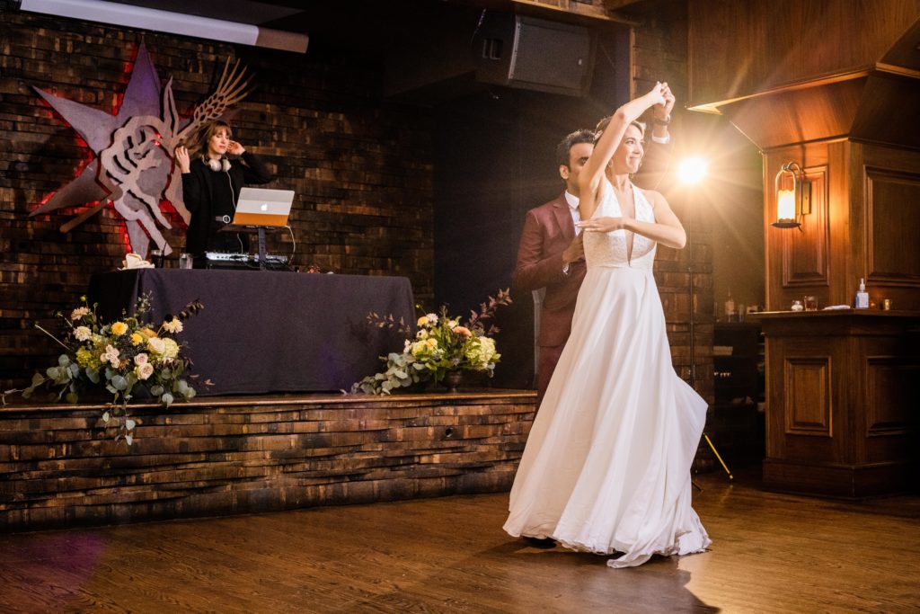 Bride twirling during their first dance at Revolution Brewing