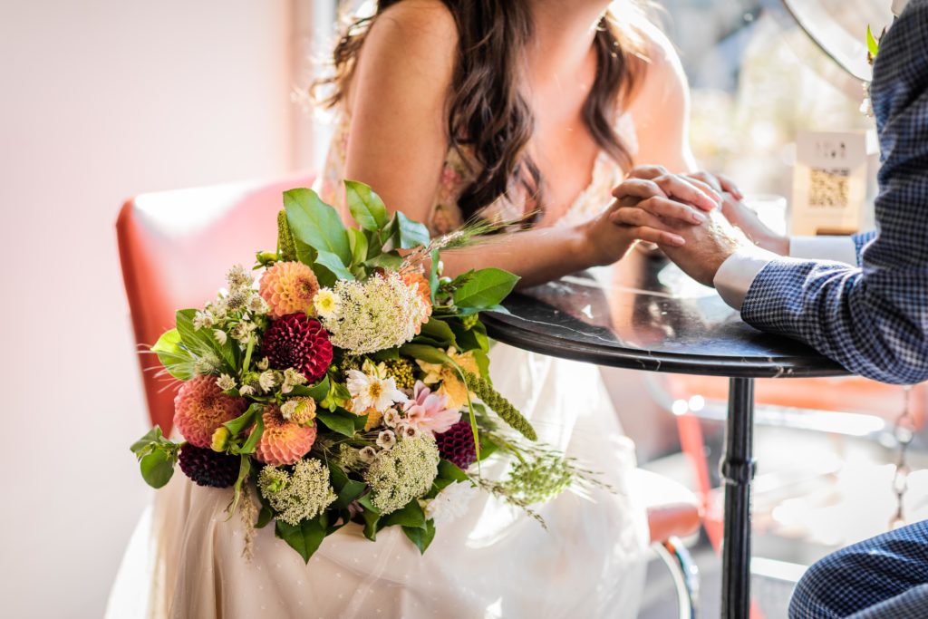 Flowers on the bride's lap in Lula Cafe
