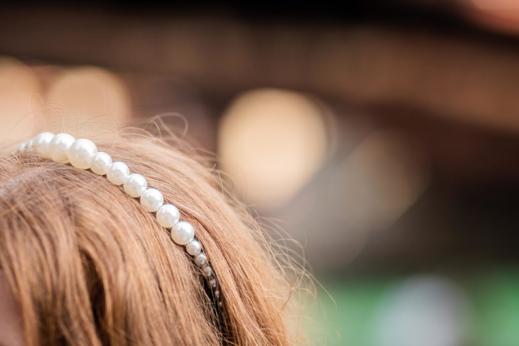 Close up of the bride's hair and pearl headband