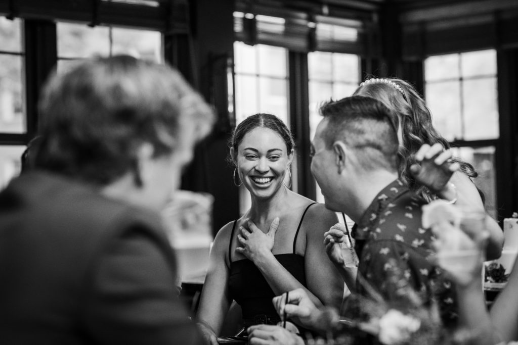 Wedding guests laughing at Kirkwood Bar