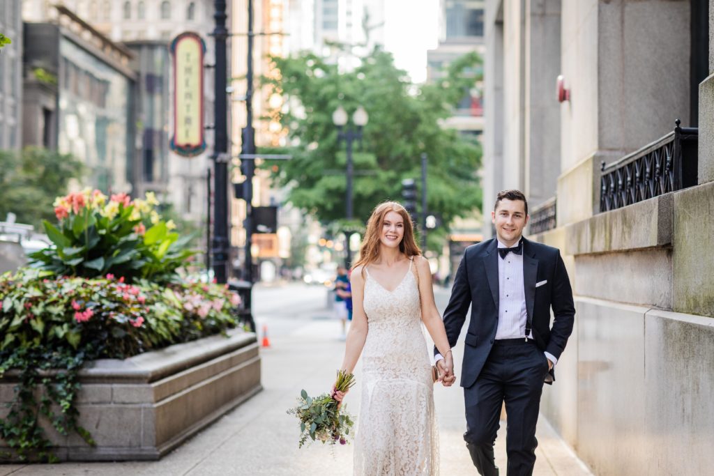 Bride and groom walking in downtown Chicago