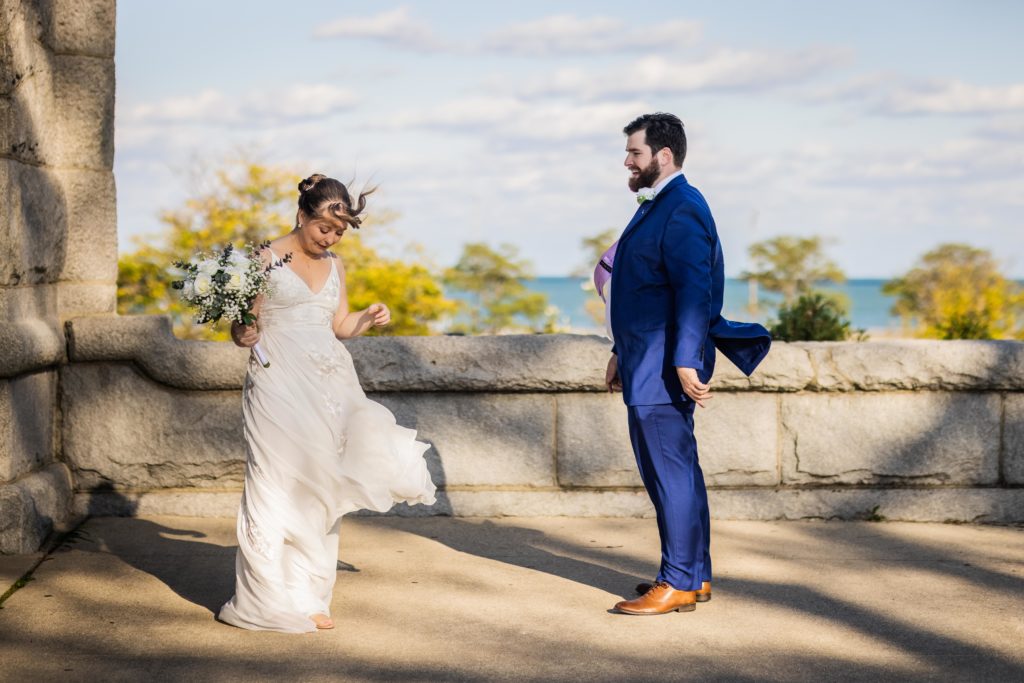 Bride showing her husband her dress