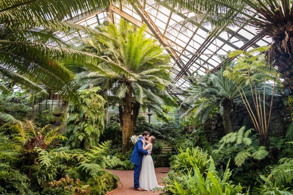 Bride and groom kissing before their Lincoln Park Conservatory wedding
