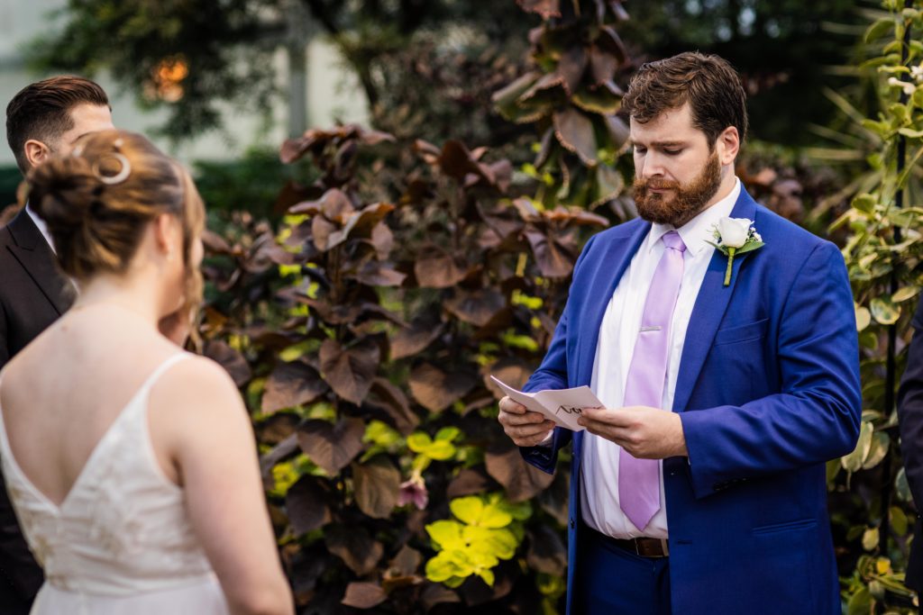 Groom reading his vows during his Lincoln Park Conservatory wedding