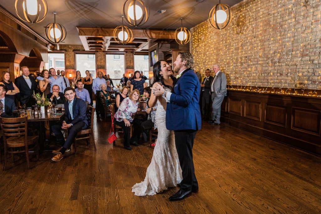 Bride and groom share a first dance at Revolution Brewing