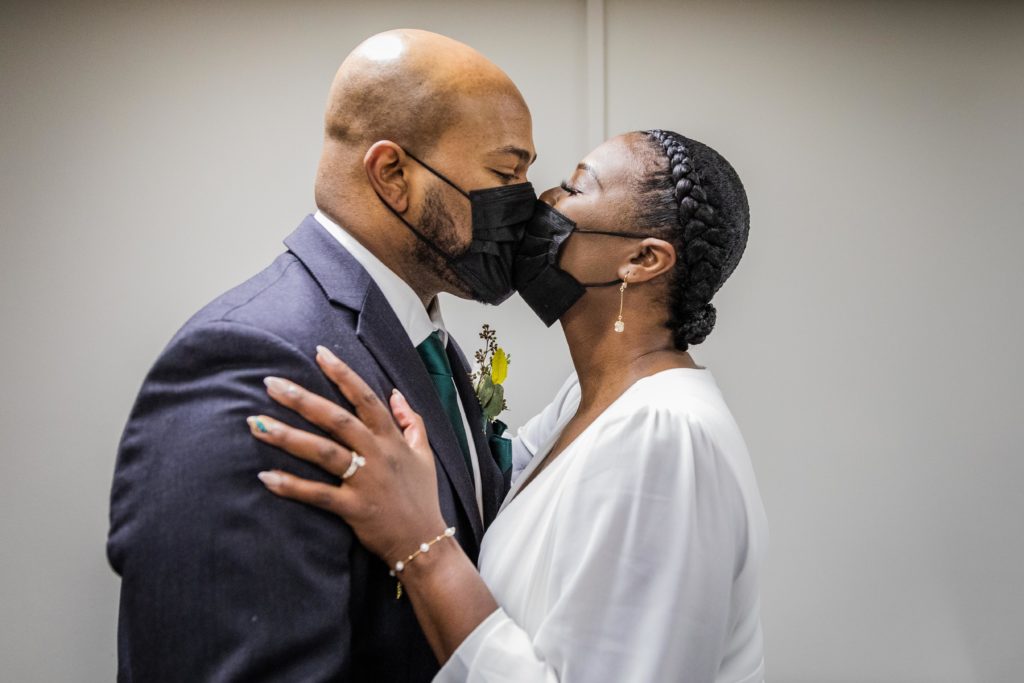 Bride and groom kiss during their Chicago city hall wedding