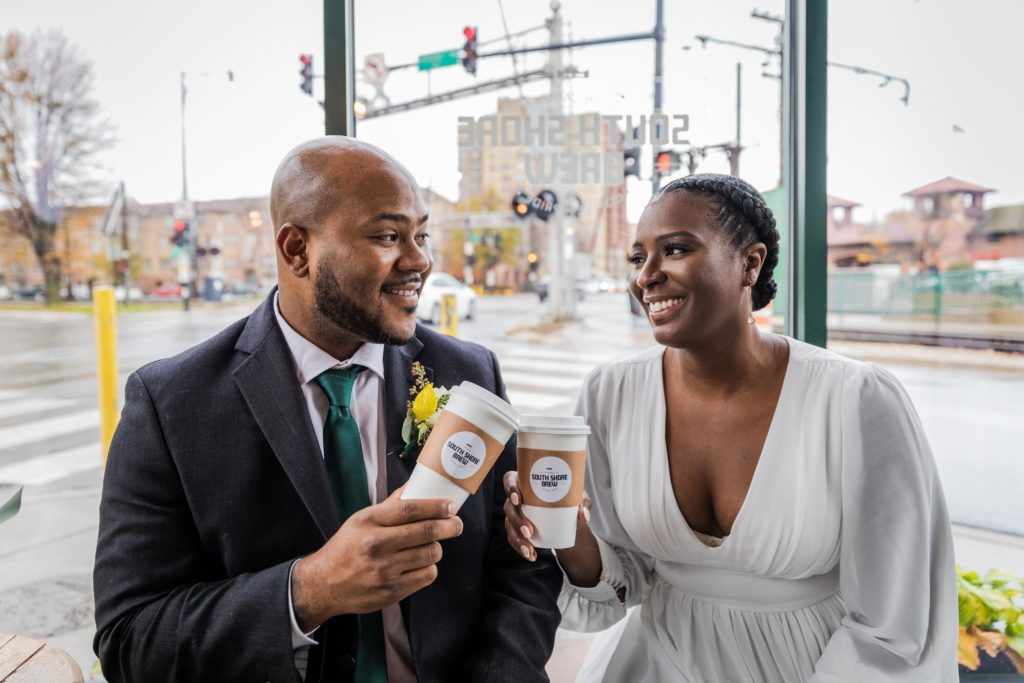 Bride and groom holding coffee at South Shore Brew