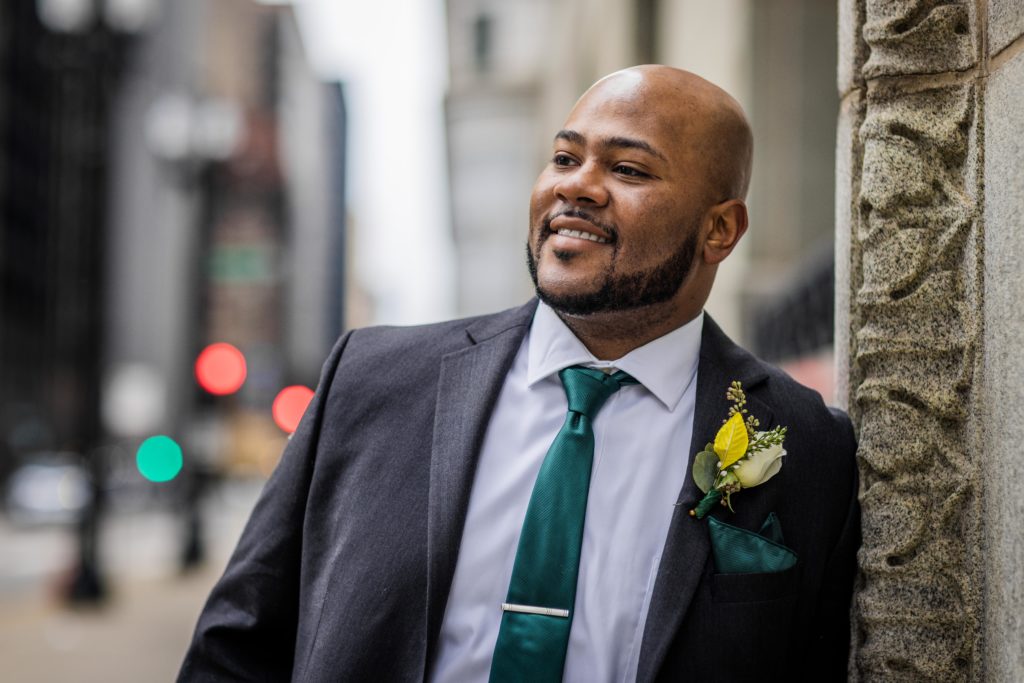 Groom smiling in downtown chicago