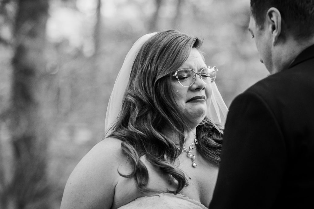 Bride cries as she sees her groom for the first time before their wedding at Starved Rock